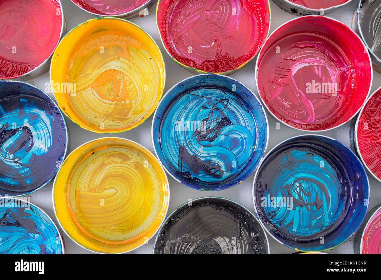 Top view of old CMYK paint cans. Colorful background Stock Photo - Alamy
