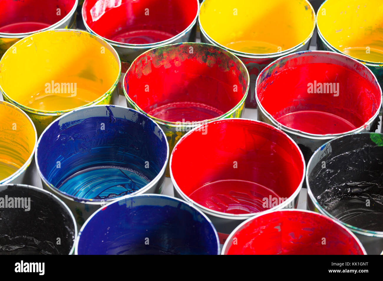 Top view of old CMYK paint cans. Colorful background Stock Photo - Alamy