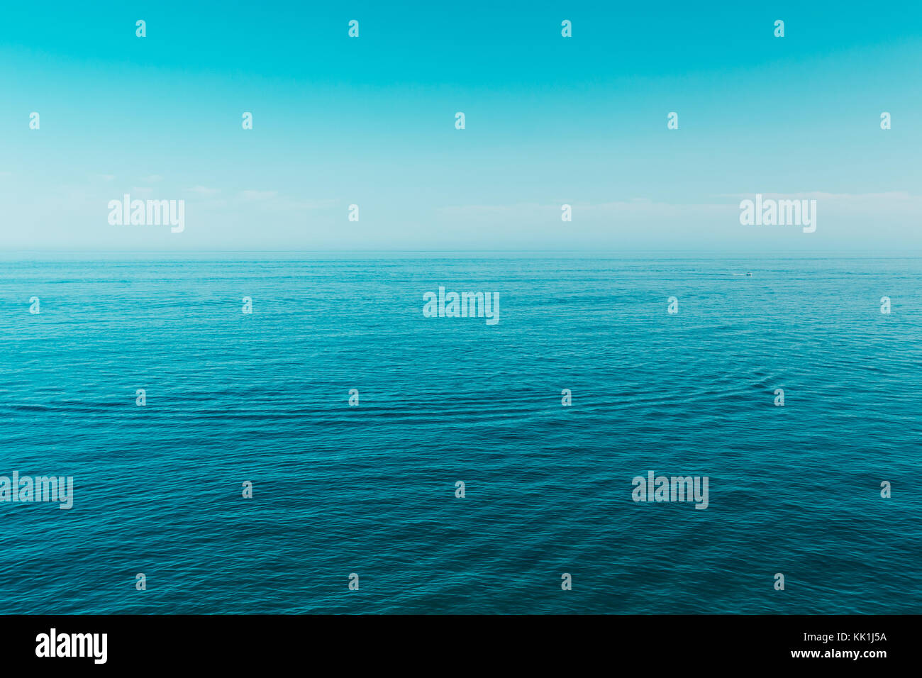 Calm Sea Ocean And Blue Clear Sky Background Stock Photo - Alamy