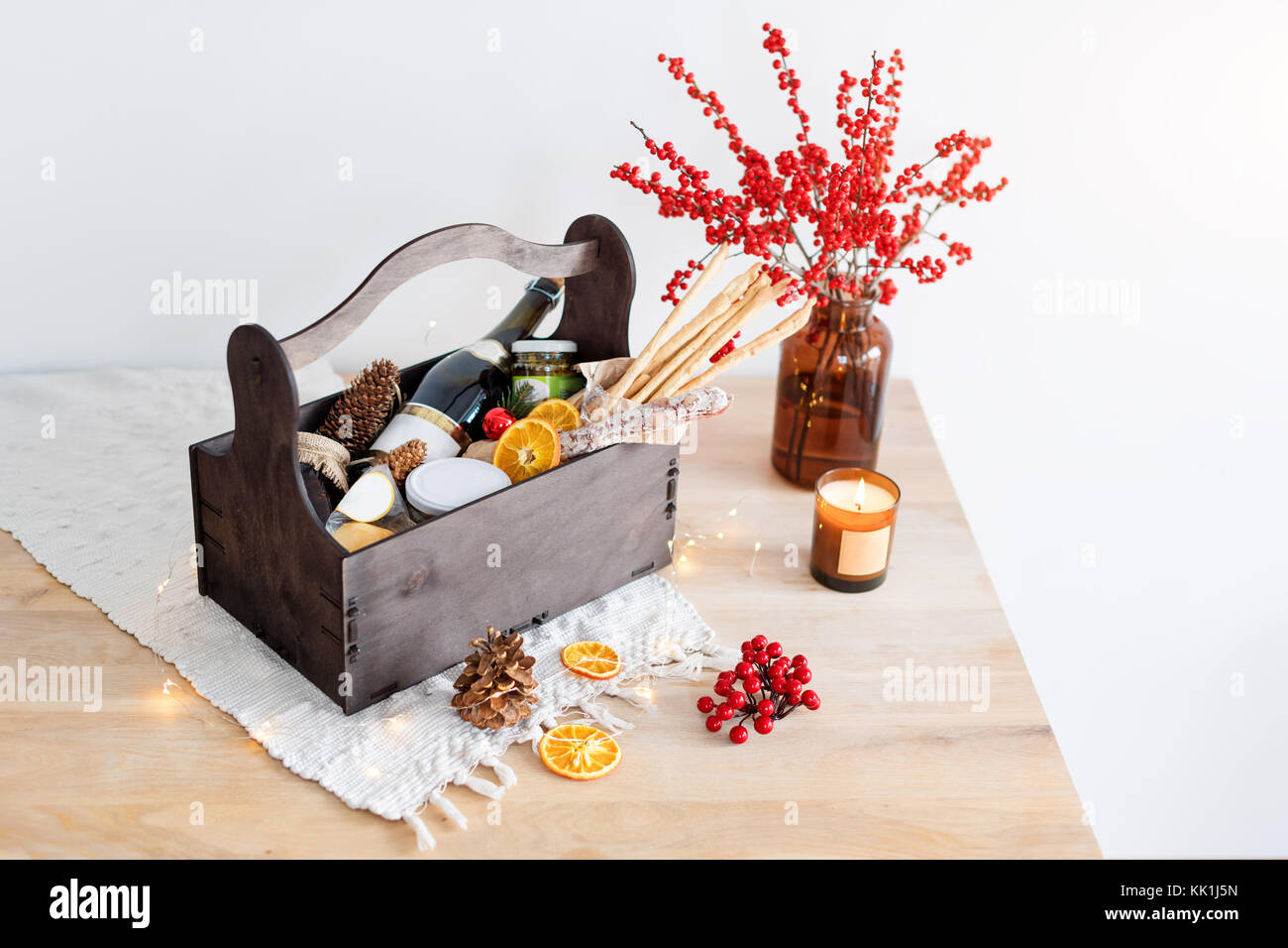 Christmas Gift Basket With Food And Decorations Stock Photo