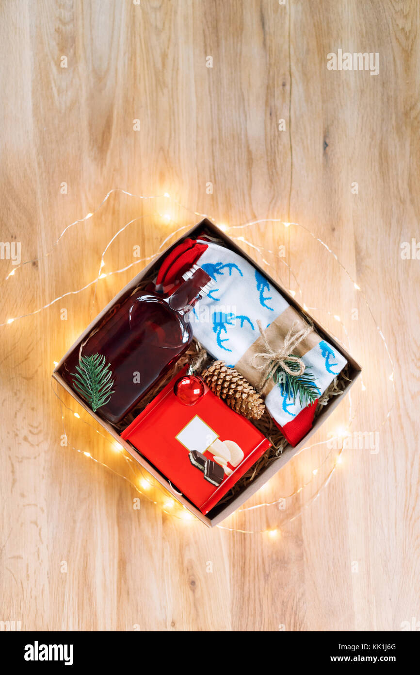 Christmas present on wooden table. Wrapping gifts at home Stock Photo