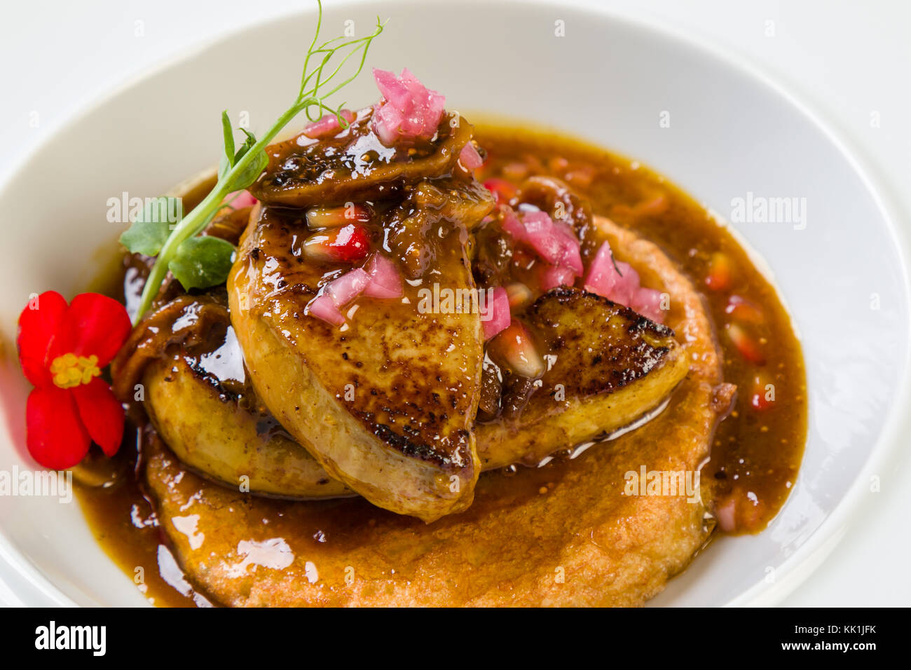 gourmet foie gras with fig sauce in white plate Stock Photo Alamy