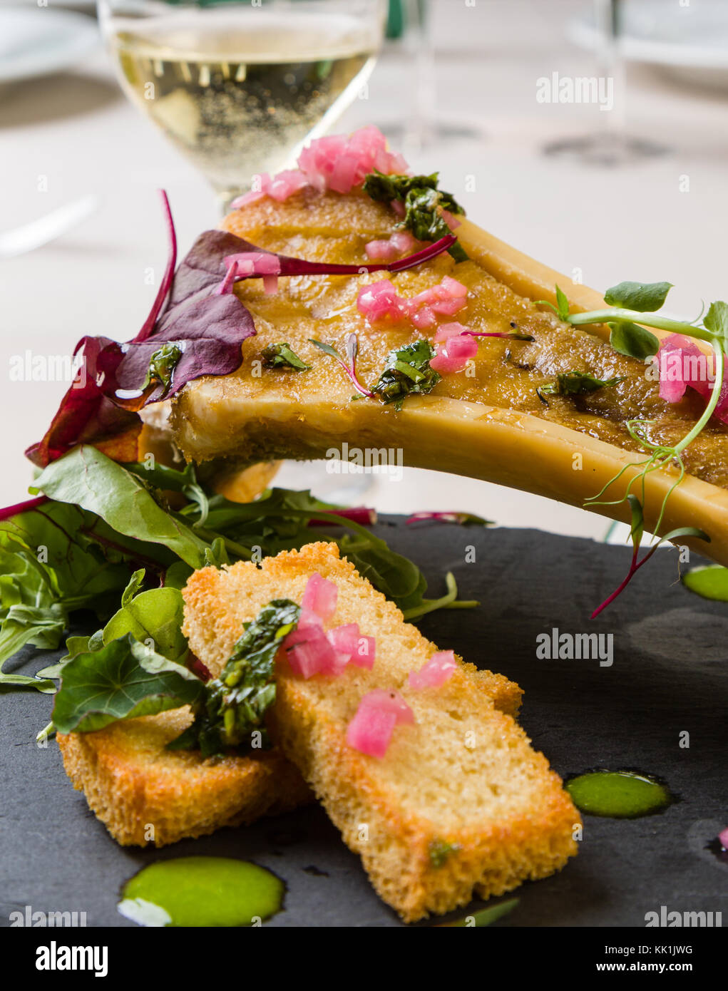 beef bone marrow with chimichurri sauce and french onion Stock Photo