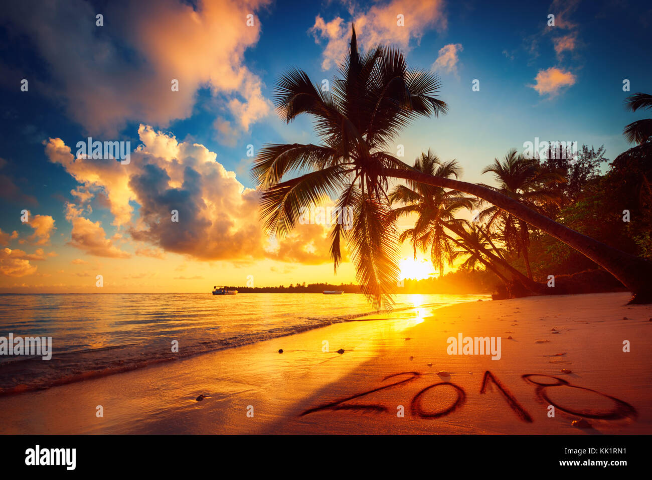 Happy New Year 2018 concept, lettering on the beach. Sea sunrise. Punta Cana Stock Photo