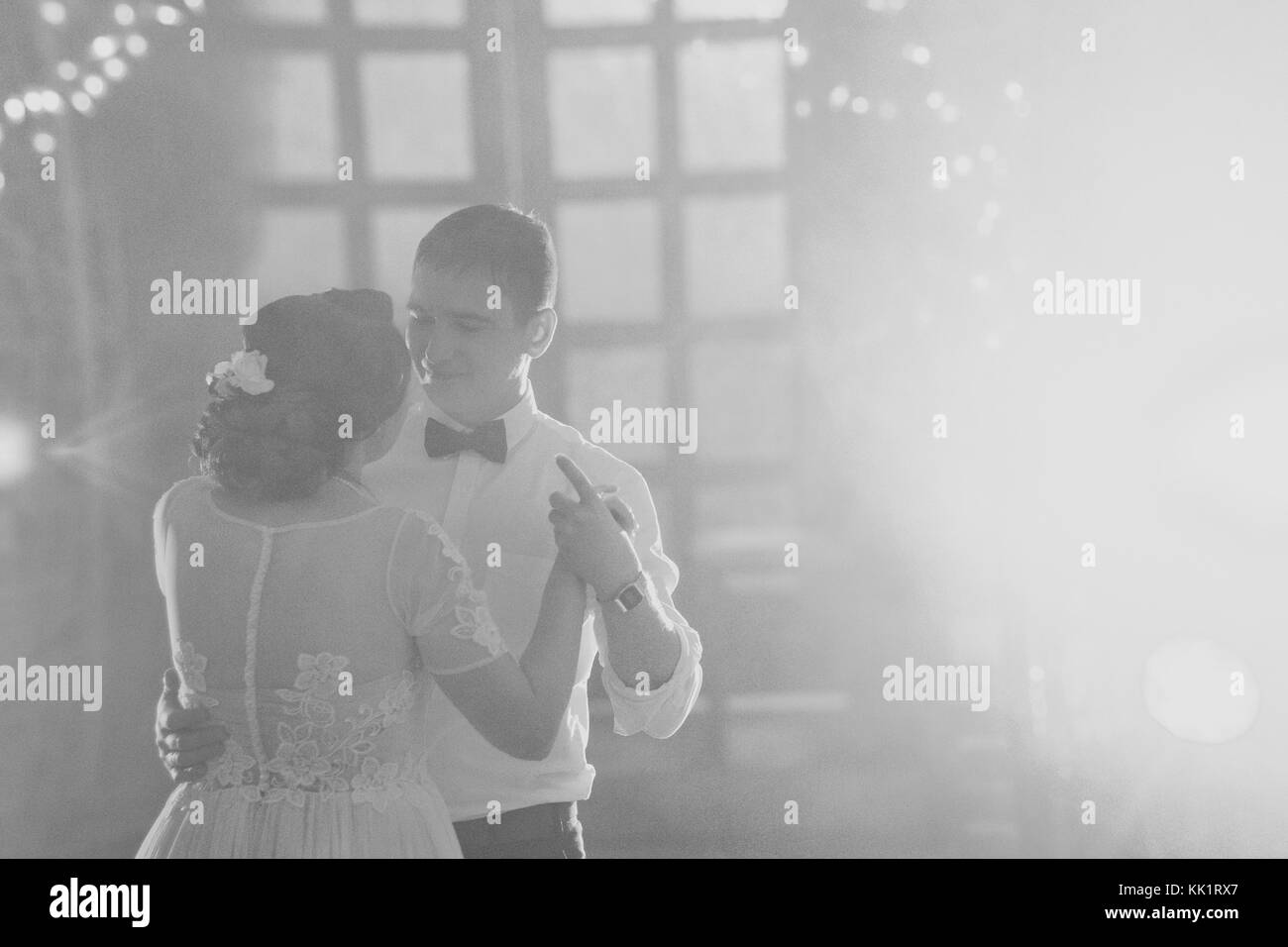 Bride and groom dancing at their wedding reception party Black and ...