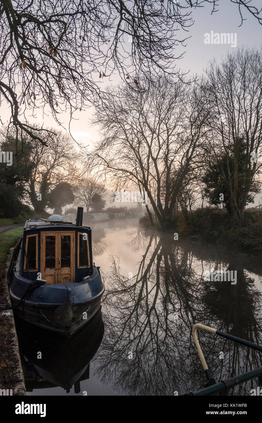 Misty early morning reflections on Kennet and Avon Canal at Bathampton, Somerset, England, UK Stock Photo