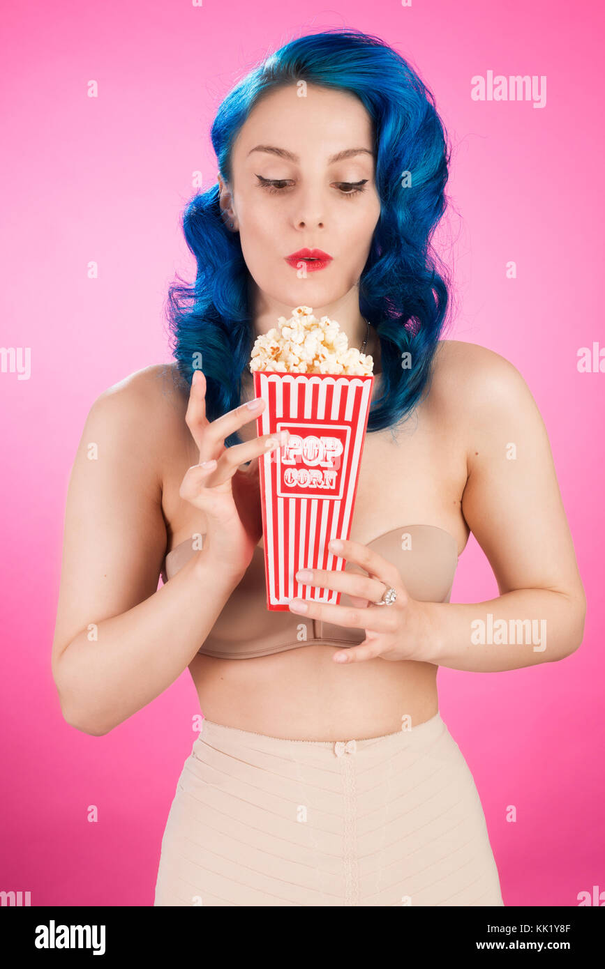 Cheeky vintage pin up girl with popcorn Stock Photo Alamy