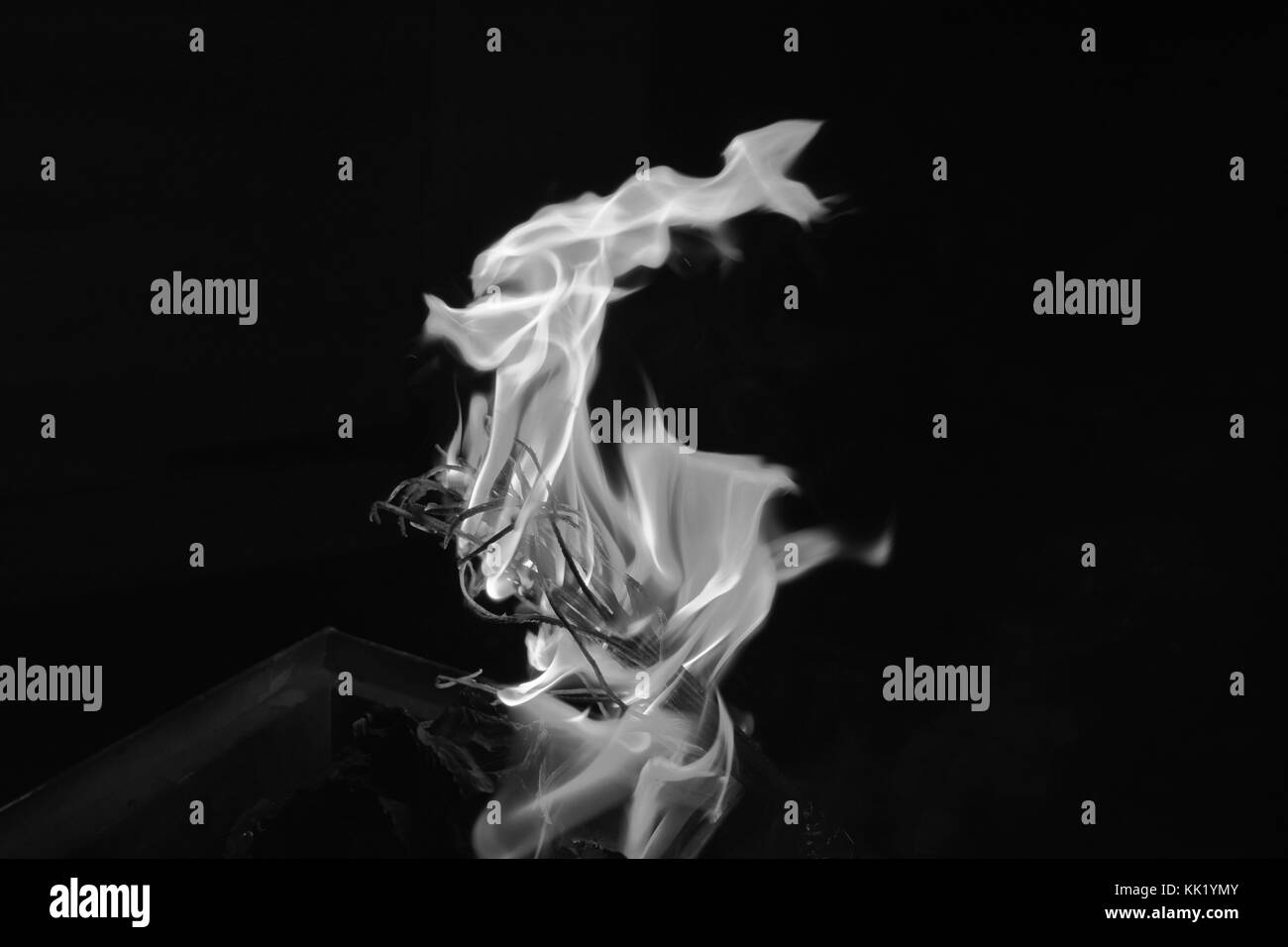 Flame, burning sticks, glass-like flames Stock Photo