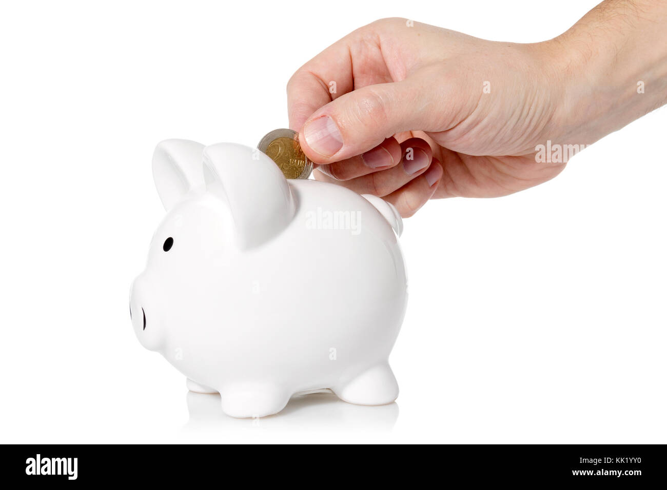 Hand putting a coin into piggy bank,isolated on white background Stock ...