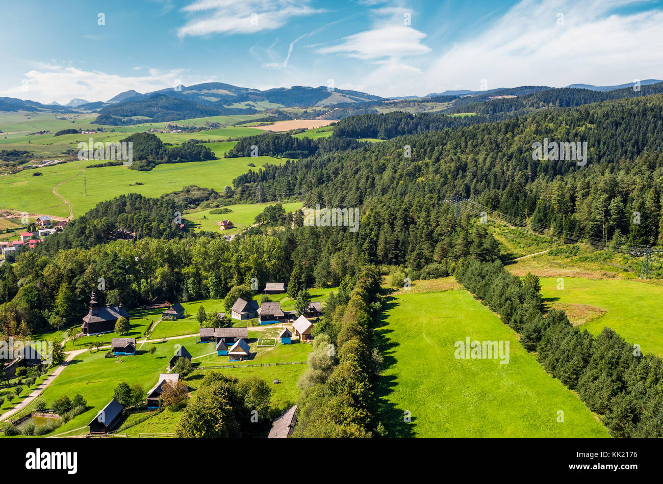 Slovakian town Stara Lubovna on forested hillside. beautiful rural scenery in mountainous area viewed from above on a summer day. Stock Photo