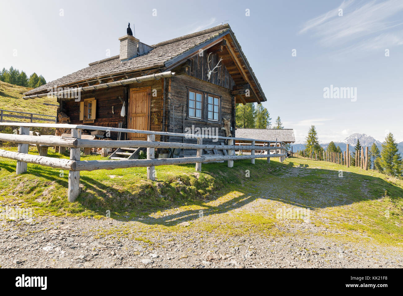 Wooden shepherd lodge on a highland pasture with Alpine mountain landscape in Western Carinthia, Austria. Stock Photo