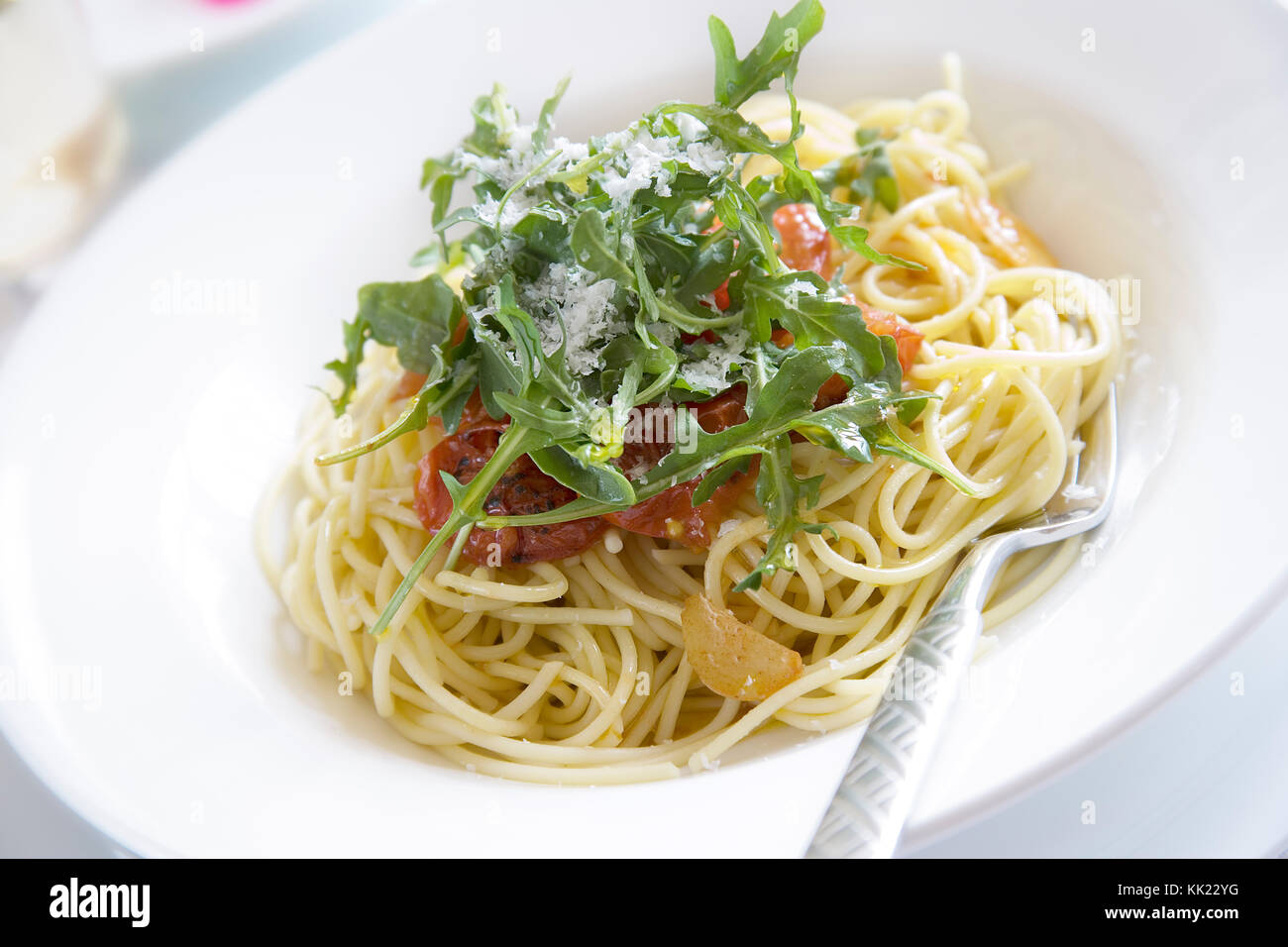 Grated parmesan with rocket tomato and spaghetti hires stock photography and images Alamy