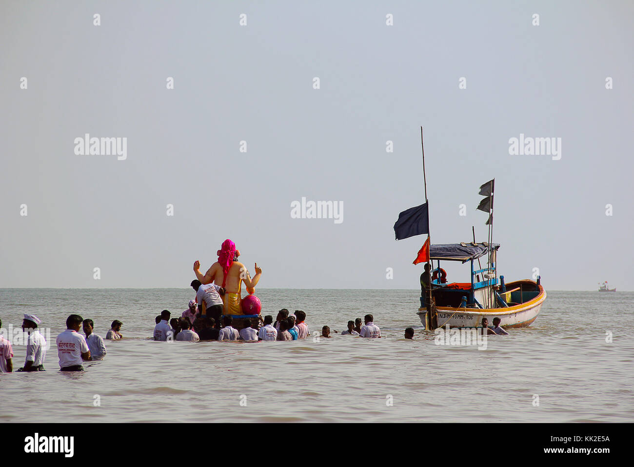 Huge Ganapati idol taken for immersion to the sea in wooden boats, Chowpatty, Mumbai Stock Photo