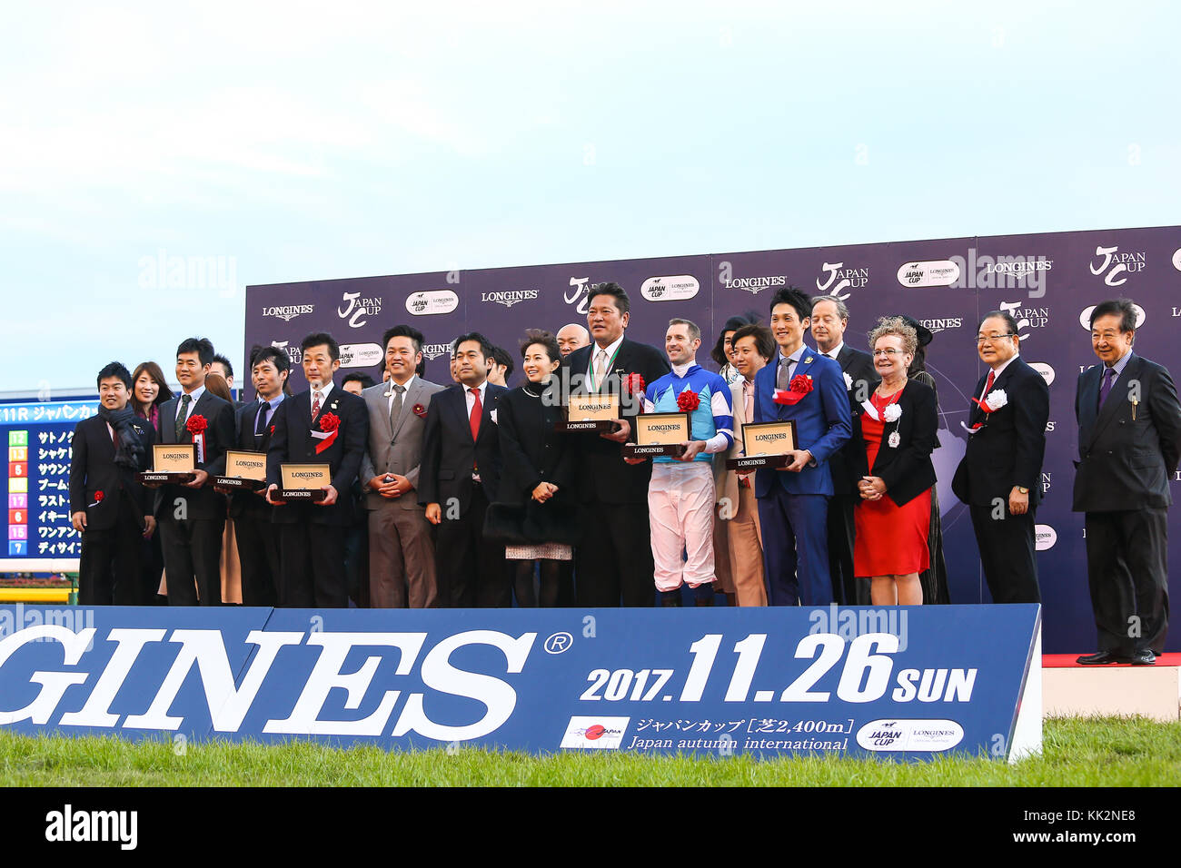 Fuchu, Tokyo, Japan. 26th Nov, 2017. Kazuhiro Sasaki, Yasuo Tomomichi, Hugh Bowman, Kanako Enomoto Horse Racing : Owner Kazuhiro Sasaki (8th R), his wife Kanako (10th R), trainer Yasuo Tomomichi (5th L) and jockey Hugh Bowman (7th R) pose during the victory ceremony after Cheval Grand won the 37th Japan Cup at Tokyo Racecourse in Fuchu, Tokyo, Japan . Credit: Yoshifumi Nakahara/AFLO/Alamy Live News Stock Photo