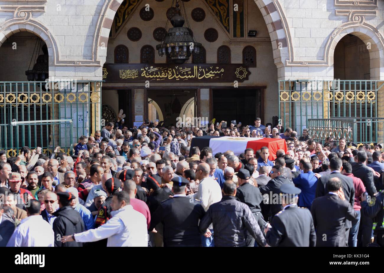 Cairo, Egypt. 29th Nov, 2017. Mourners carry the bier of the late popular singer and actress Shadia, draped with an Egyptian flag, during her funeral at the Sayeda Nafisa mosque in the capital Cairo on November 29, 2017. Shadia, born in Egypt in 1931 as Fatma Shaker, who after starring in 110 films and several musical plays since her debut in 1947, gave up both singing and acting in the mid 1980s. The 86-year-old film star passed away in Cairo on November 28, 2017 after falling into coma recently following a brain haemorrhage Credit: Amr Sayed/APA Images/ZUMA Wire/Alamy Live News Stock Photo