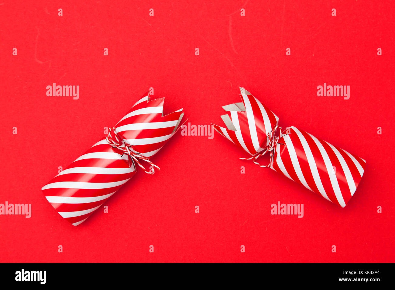 Christmas crackers on a red background Stock Photo Alamy