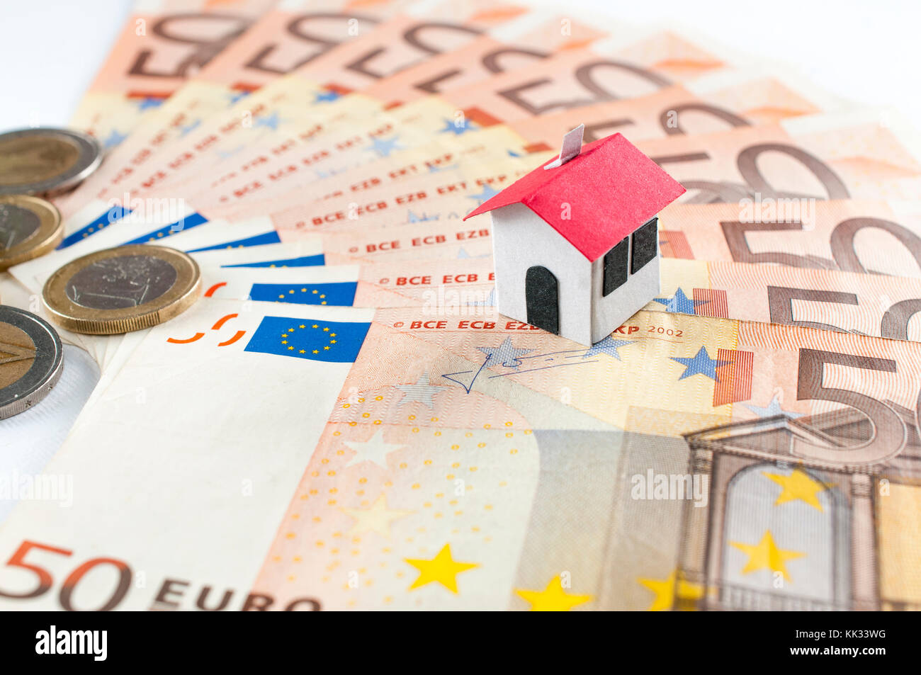 Paper house on a fifty euros banknote fan: mortgage and loan concept Stock Photo