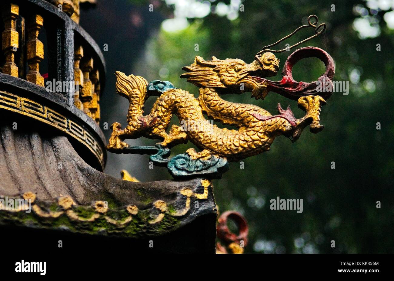 Qingyang Gong Taoist temple, also called Green Ram / Goat Temple. Tang Dynasty. Chengdu, China. Bronze dragon on incense stand Stock Photo