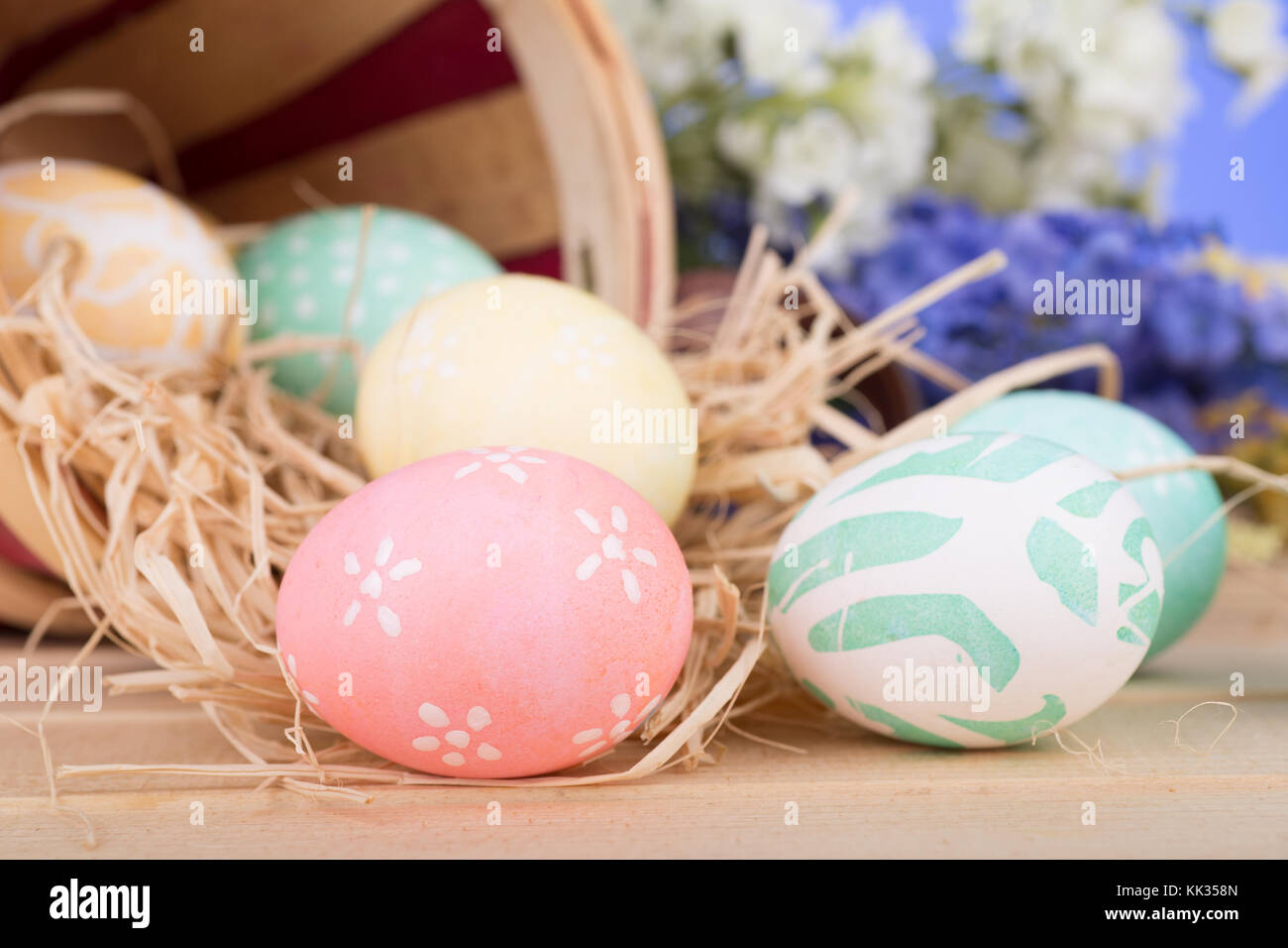 Decorated Easter eggs spilled from a basket Stock Photo Alamy