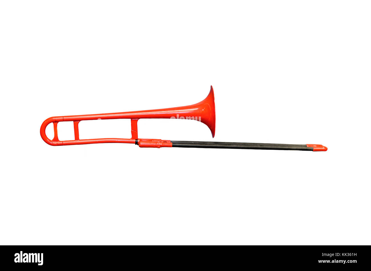 Red trombone on the white background, are located horizontally Stock