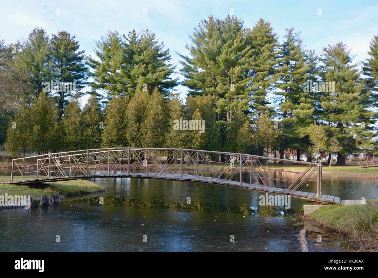 Victorian arched bridges, islands and fountains in Crandall Park in Glens Falls, Upstate New York, United States of America in the Autumn Stock Photo