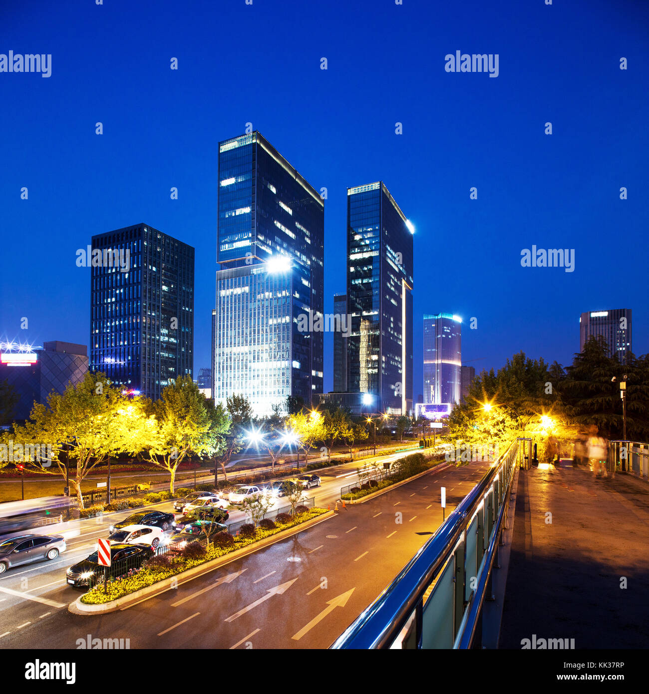 modern office building in midtown of modern city at night Stock Photo ...