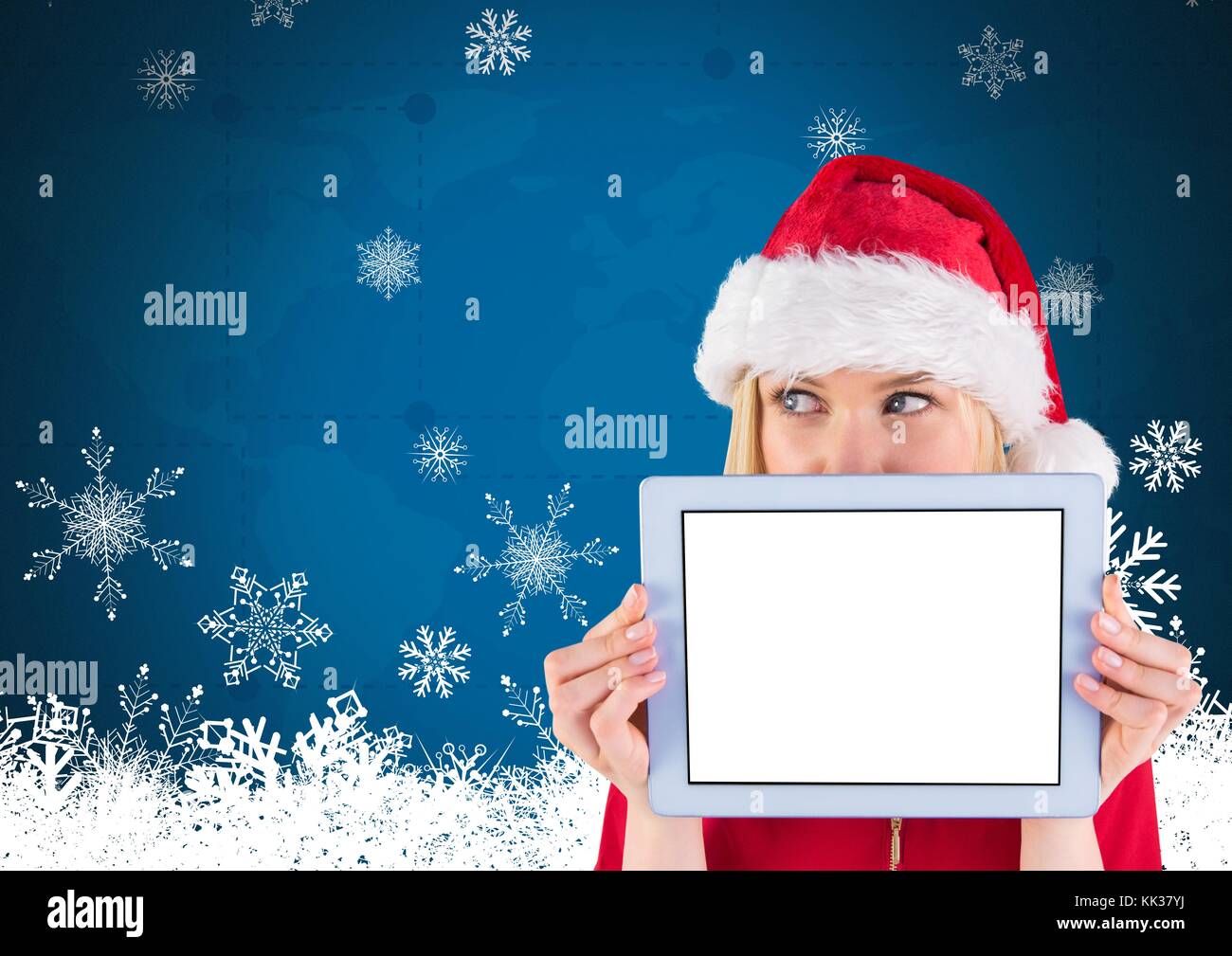Digital composite of female Santa holding tablet Stock Photo - Alamy