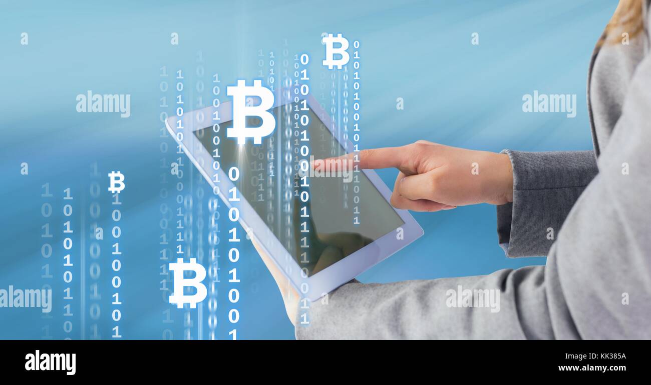 Digital composite of Bitcoin icons and interface on tablet in woman's ...