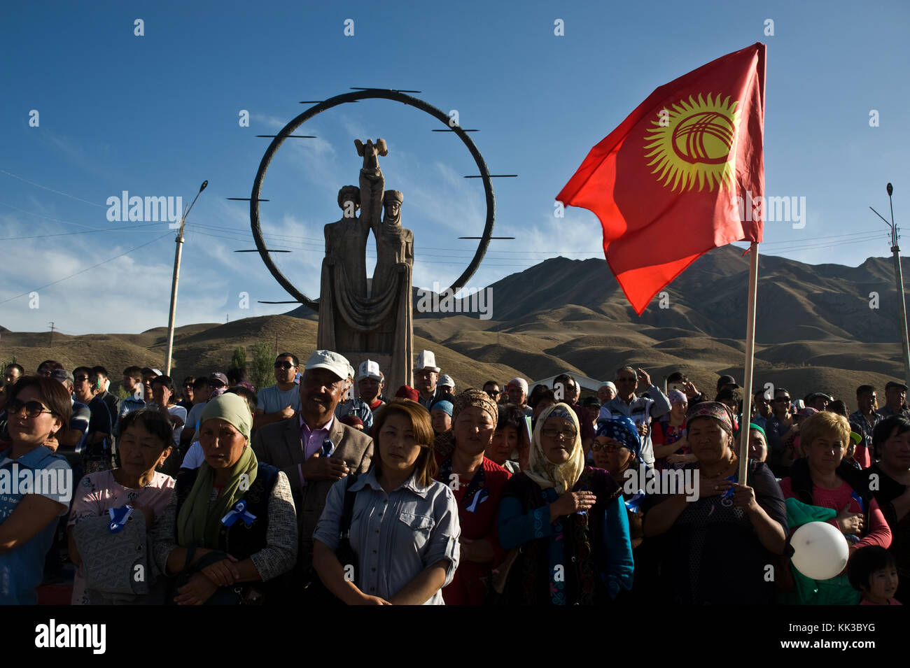 Political meeting in Kyrgyzstan. In the background, the freedom statue. Stock Photo