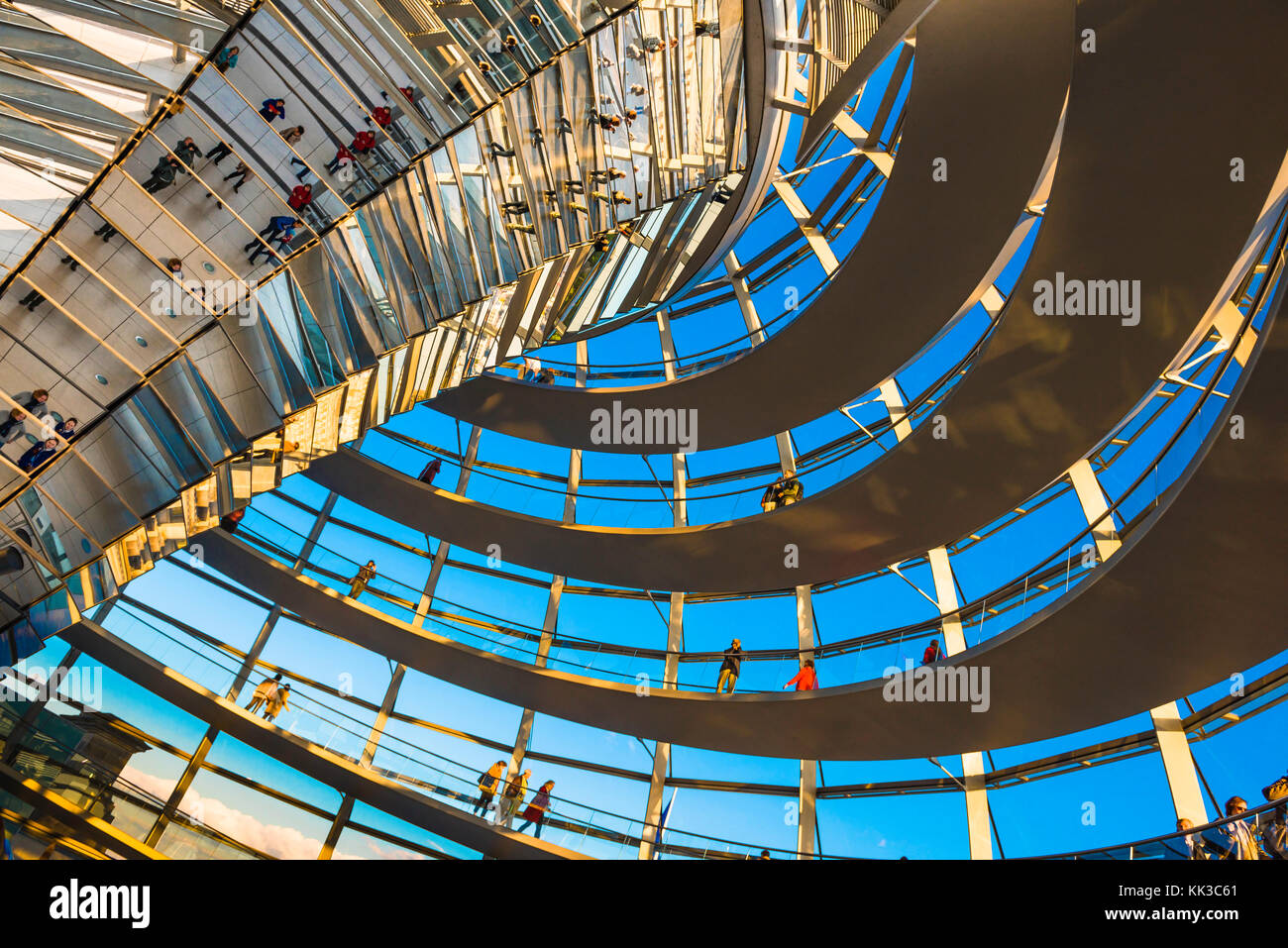 Modern Berlin, view of tourists walking on the spiral walkway inside the Norman Foster designed glass dome of the German parliament building, Berlin Stock Photo