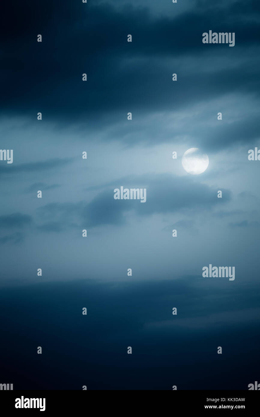 Moon on night sky with clouds Stock Photo - Alamy