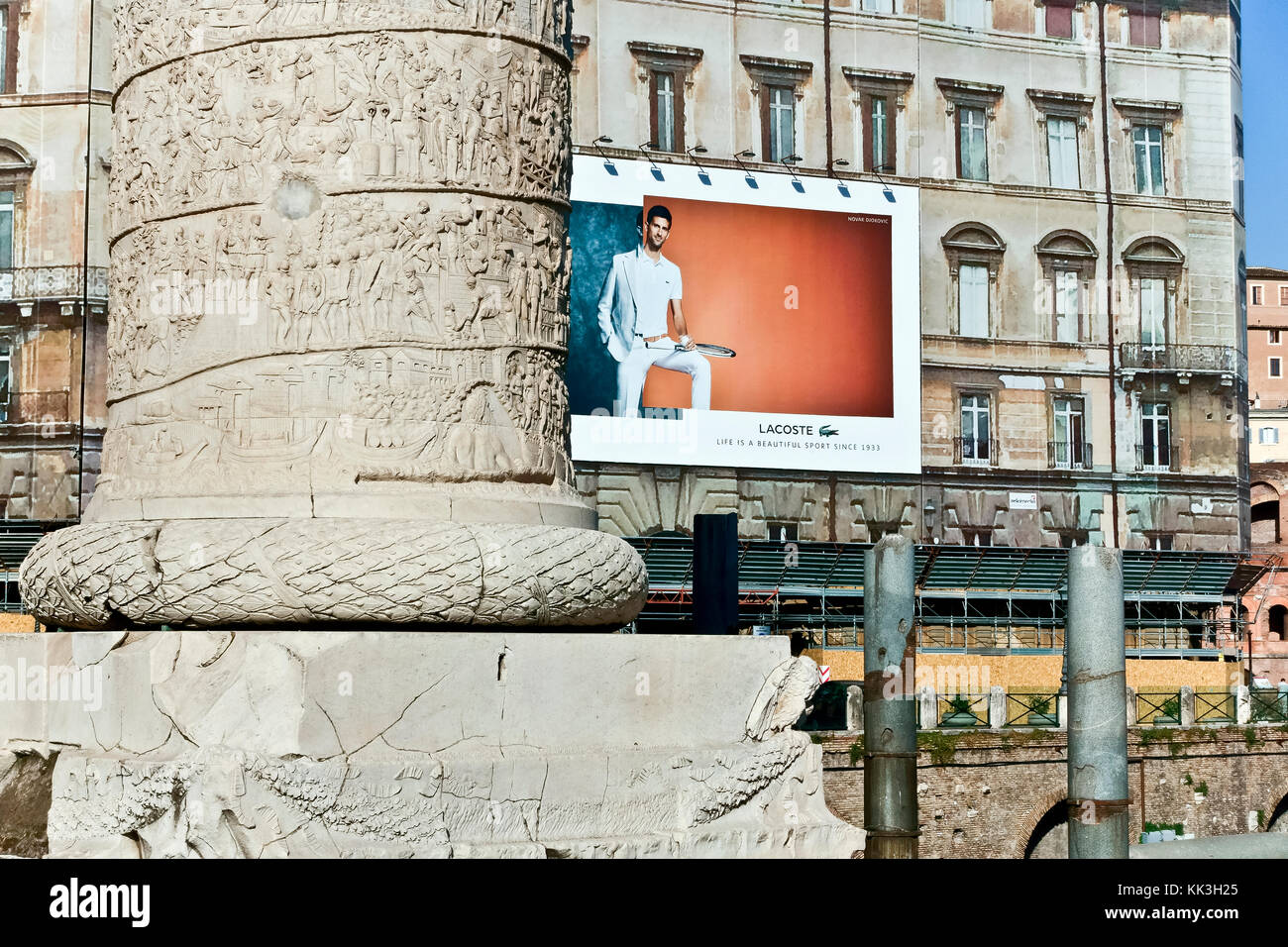 advertising billboard on a building scaffolding at Trajan's Market Trajan's column close up. Rome, Italy, Europe. New and old contrast Stock Photo - Alamy