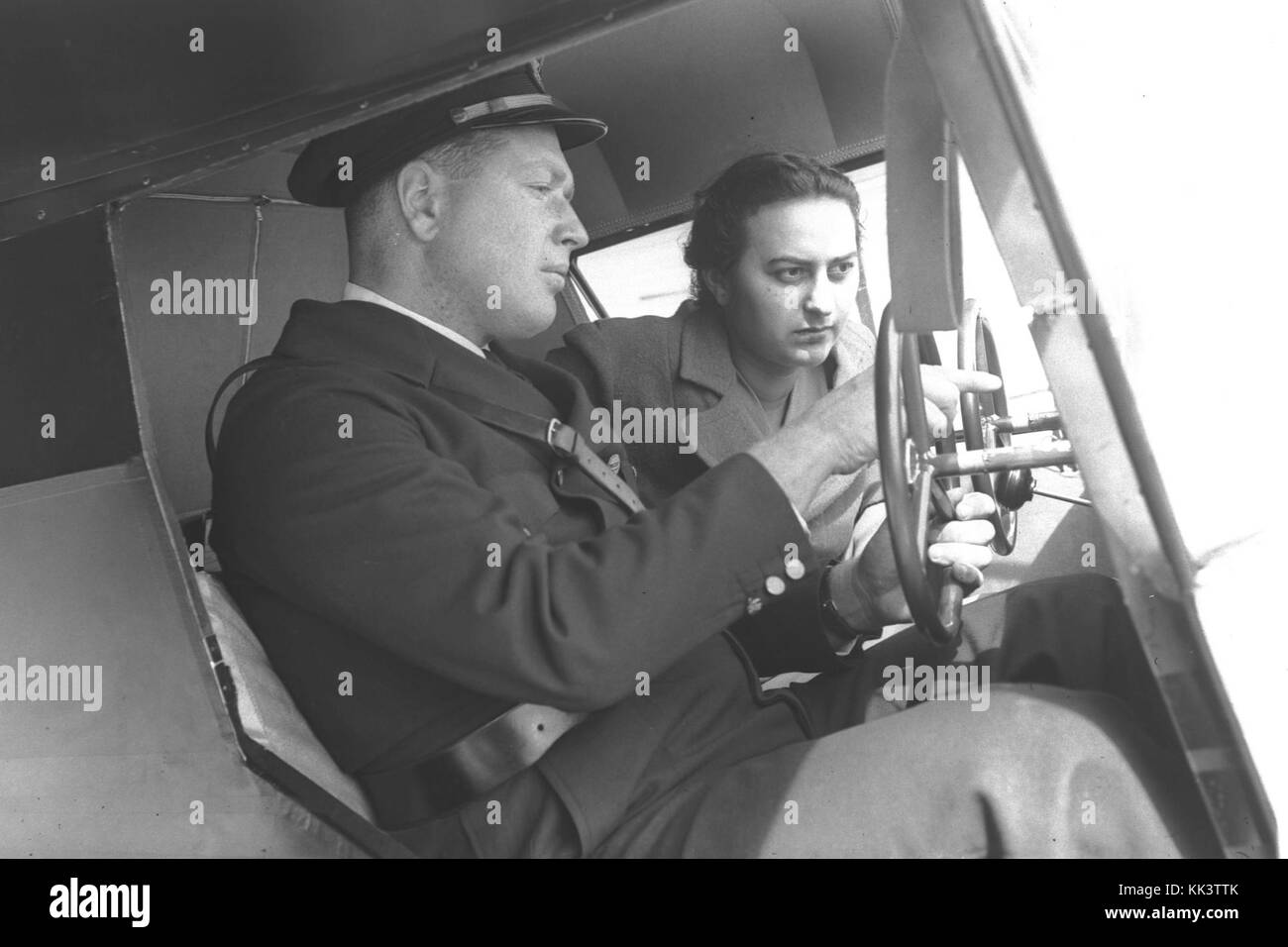 FLYING INSTRUCTOR FREDDY KATZ WITH A TRAINEE IN THE COCKPIT OF ONE OF THE TRAINING PLANES AT THE KATZ (PALESTINE FLYING SERVICE) FLYING SCHOOL IN LOD.D2 059 Stock Photo