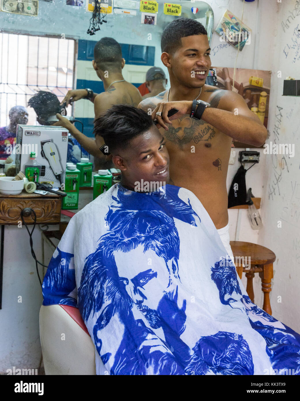 Cuban barber shop and hairdressing salon, hairdresser cut's a clients