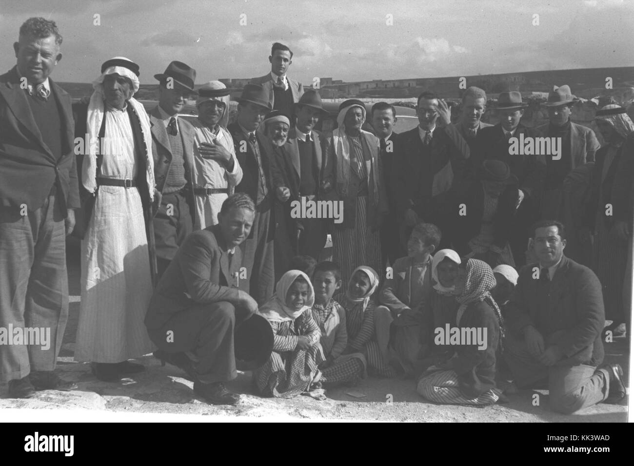 JEWISH VISITORS FROM ZICHRON YA'ACOV POSING FOR A FAREWELL PICTURE WITH JABRI AMIN EL HAJ AND MEMBERS OF HIS FAMILY BEFORE THEIR DEPARTURE FROM THE SUD1 076 Stock Photo