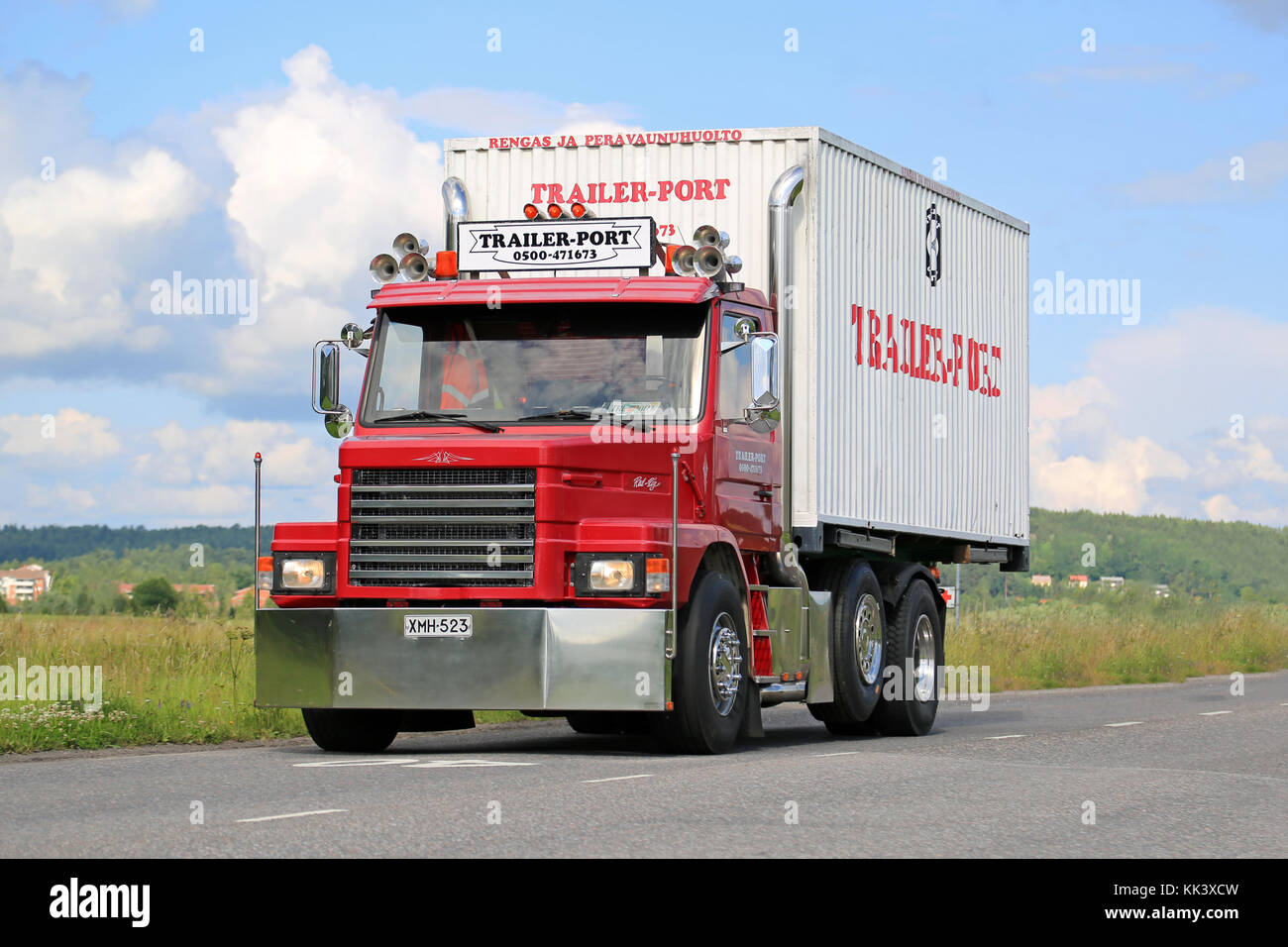 SALO, FINLAND - JULY 17, 2015: Red, tuned Scania T92 on the road. The Swedish truck manufacturer Scania introduced the 2-series in 1980, and the 9 lit Stock Photo