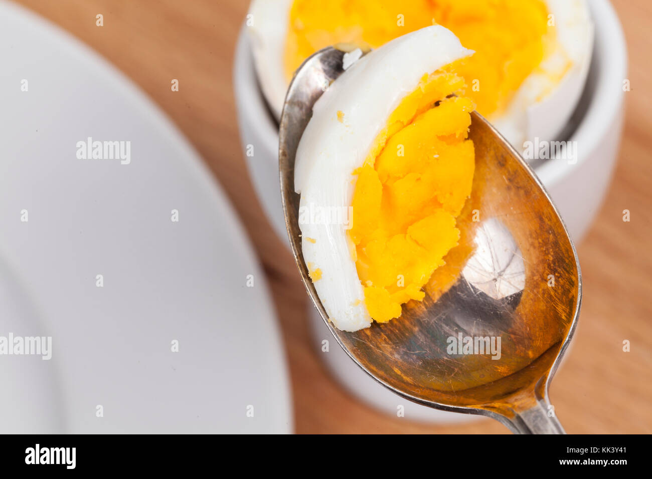 Eat an egg with a spoon Stock Photo
