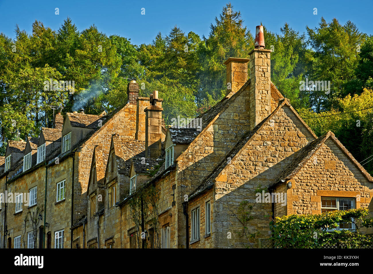 Cottages stepping up the hillside in the pretty Cotswold village of Snowshill Stock Photo