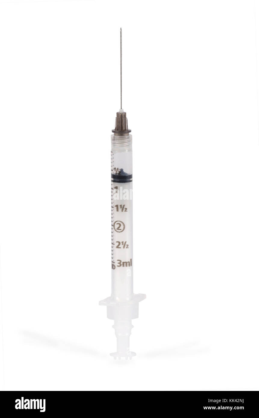 A hypodermic syringe sits on a clean white background Stock Photo