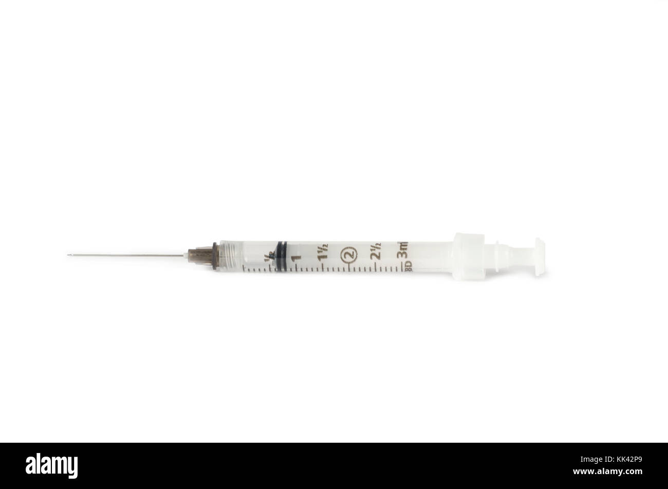 A hypodermic syringe sits on a clean white background Stock Photo