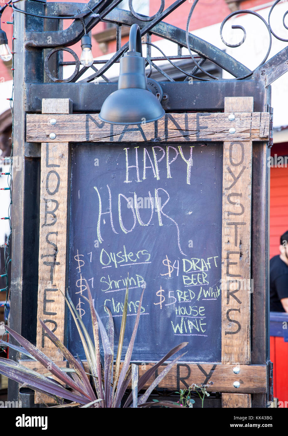 Happy Hour sign in front of a Brooklyn restaurant Stock Photo