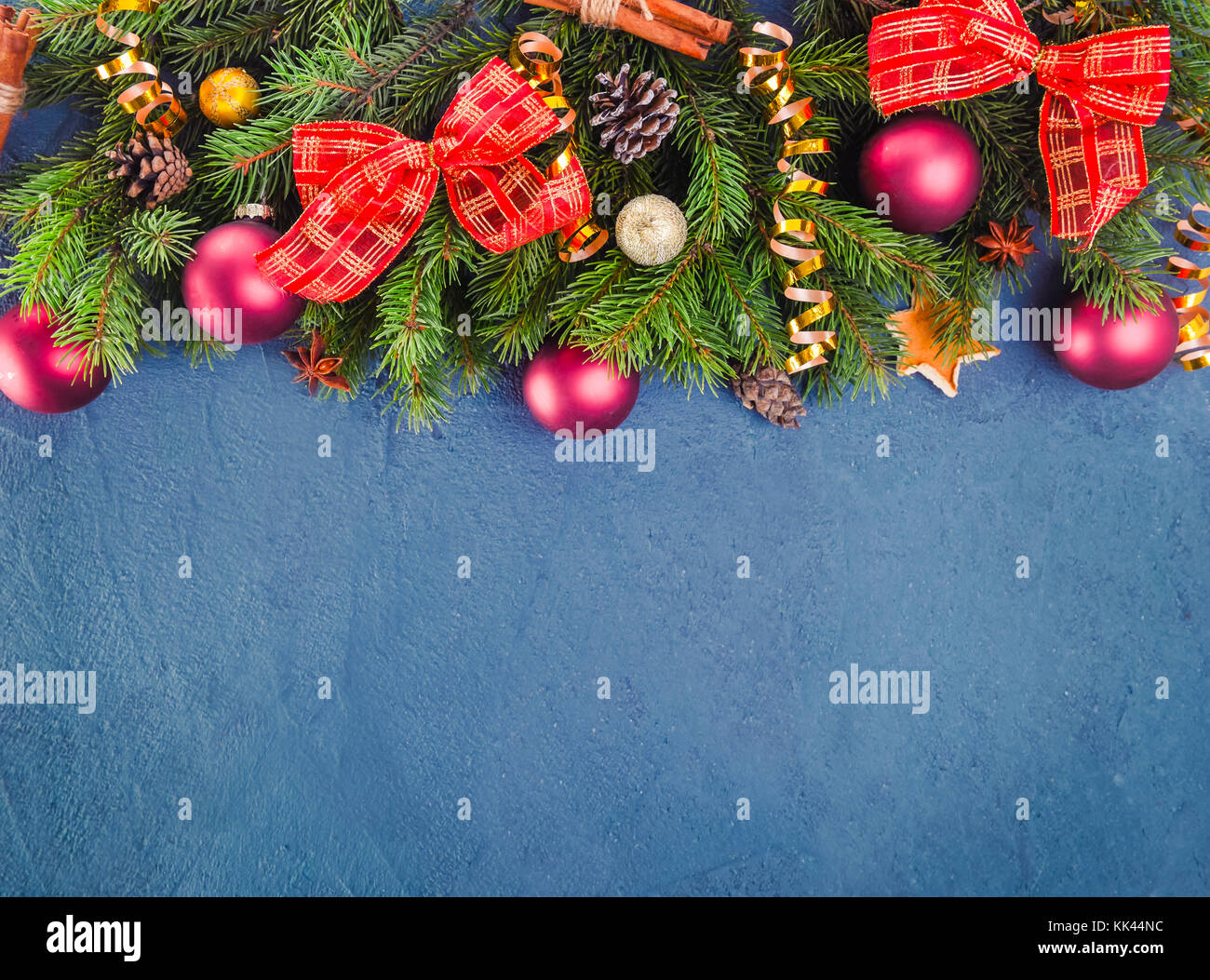 Dark blue christmas background with fir branches and new year decor and ...