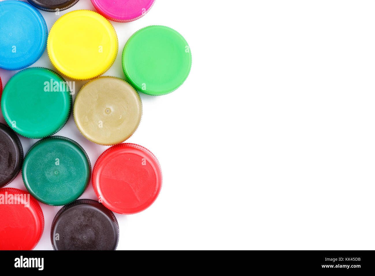 many plastic covers of different colors, isolated on white background ...