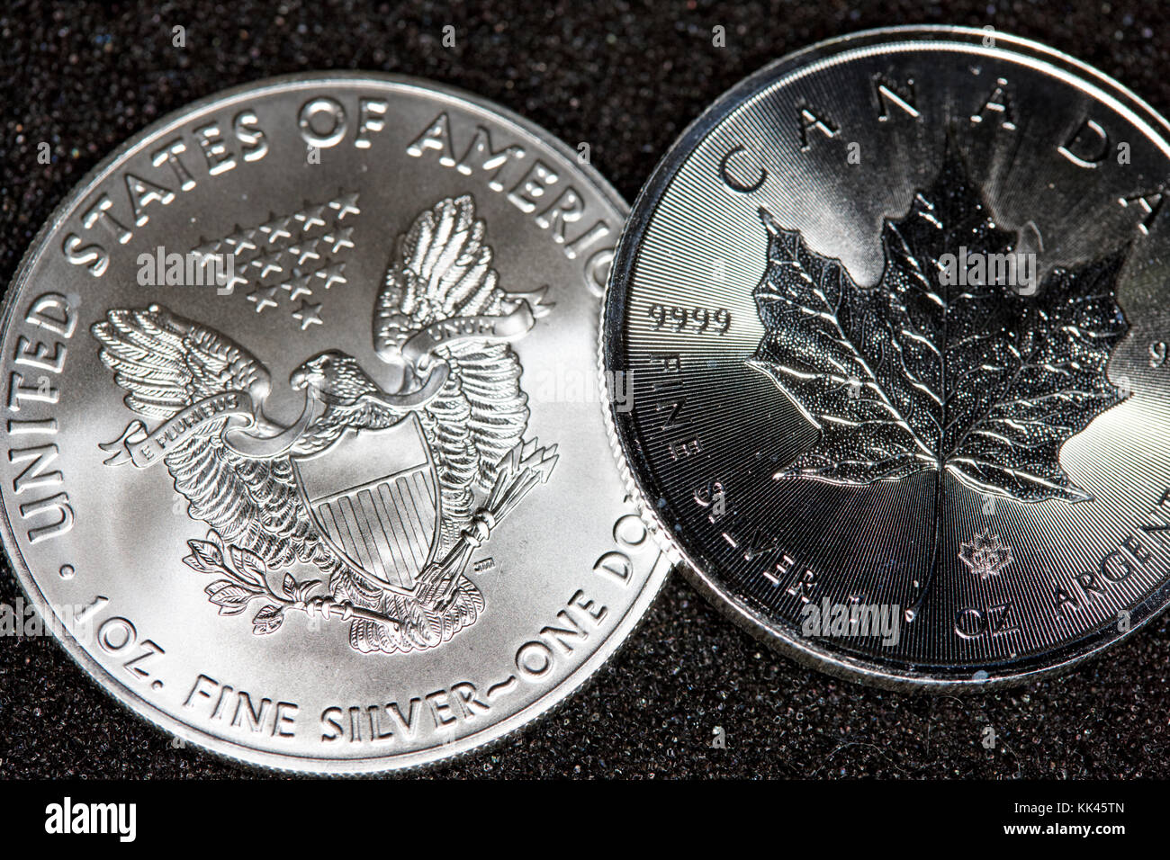 1oz silver bullion coins united states eagle and canadian maple leaf Stock Photo