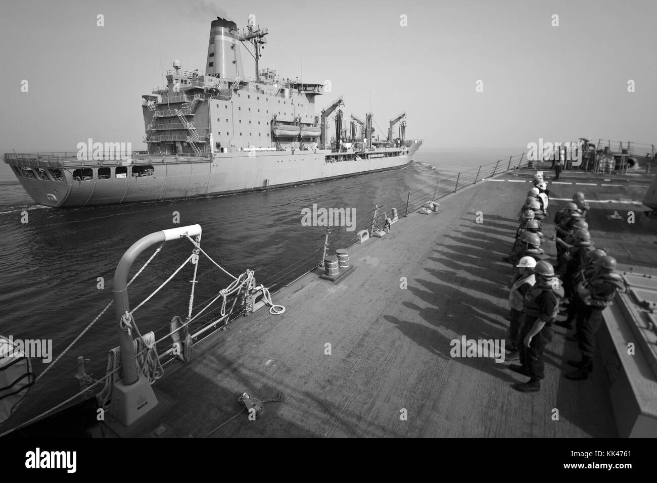 Sailors aboard the guided-missile destroyer USS Porter DDG 78 stand by to conduct a replenishment at sea with the Military Sealift Command fleet replenishment oiler USNS Guadalupe T-AO 200, Arabian Gulf, 2012. Image courtesy Mass Communication Specialist 2nd Class Alex Forster/US Navy. Stock Photo