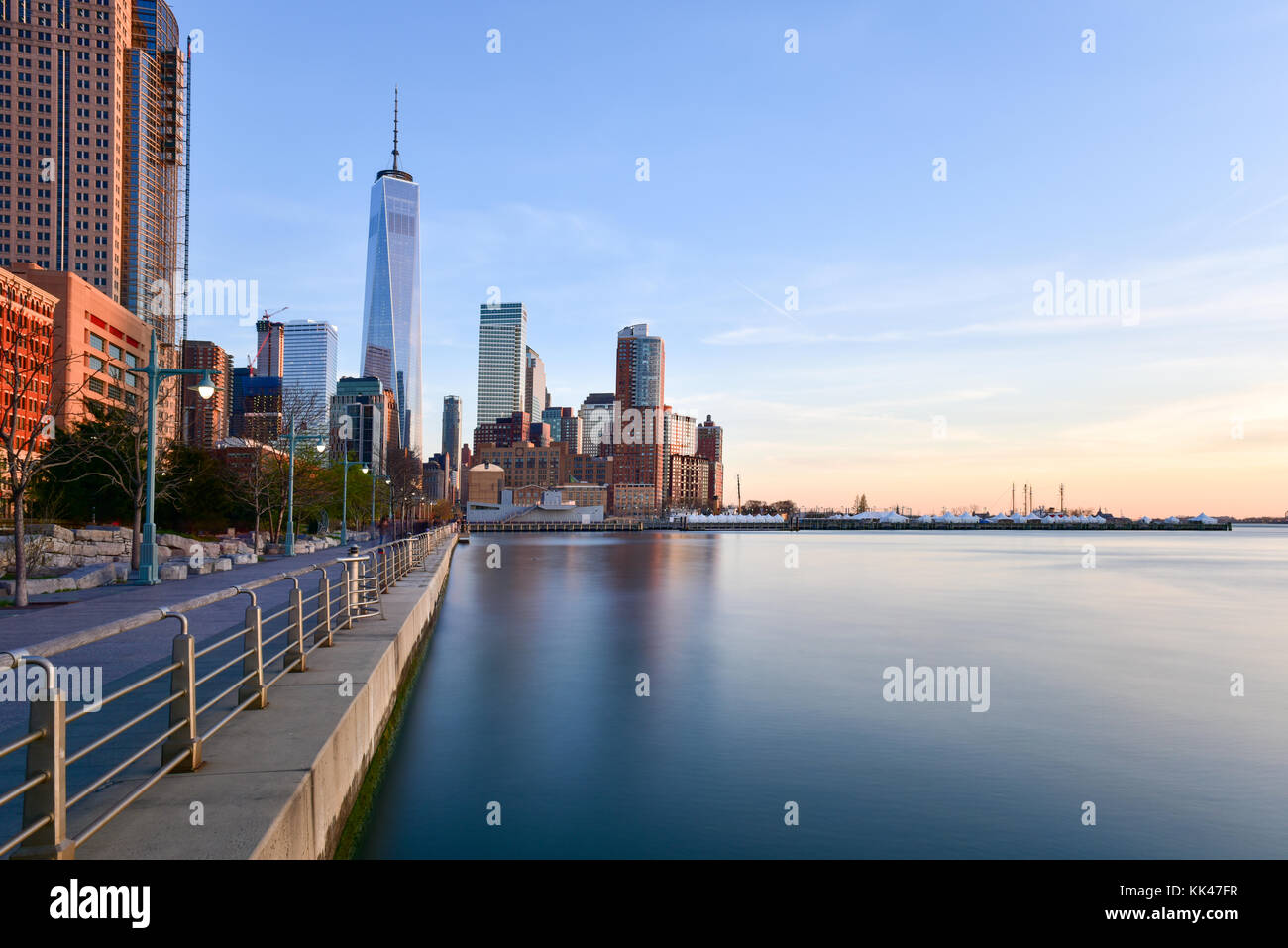 Battery Park and New Jersey skyline at sunset from Manhattan, New York City over the Hudson River. Stock Photo