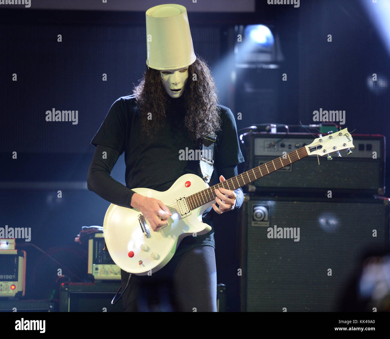 FORT LAUDERDALE, FL - FEBRUARY 28: Brian Patrick Carroll AKA Buckethead performs at The Culture Room. Brian Patrick Carroll (born May 13, 1969), known professionally as Buckethead, is an American guitarist and multi-instrumentalist who has worked within many genres of music. He has released 264 studio albums, four special releases and one EP. He has also performed on more than 50 other albums by other artists. His music spans such diverse areas as progressive metal, funk, blues, jazz, bluegrass, ambient, and avant-garde music. Buckethead is famous for wearing a KFC bucket on his head, emblazon Stock Photo