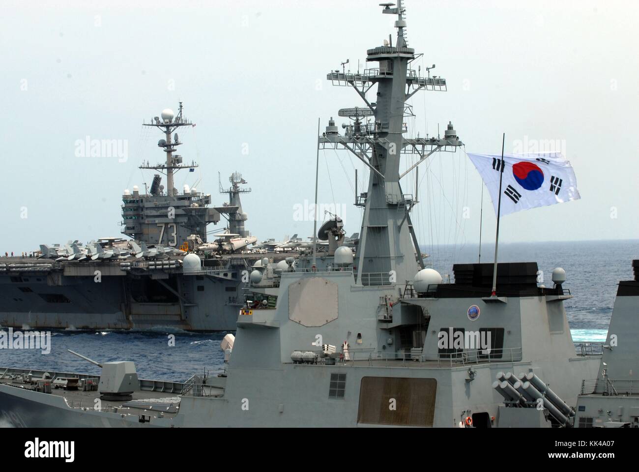 The aircraft carrier USS George Washington CVN 73 and the Republic of Korea navy destroyer ROKS Sejong the Great DDG 991 participate in a trilateral event, East China Sea, 2012. Image courtesy Mass Communication Specialist 1st Class Jennifer A. Villalovos/US Navy. Stock Photo