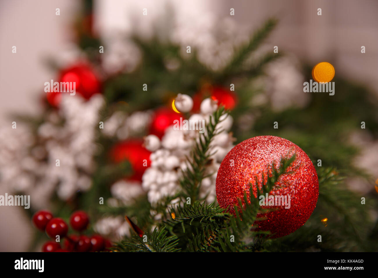 Christmas tree branch with red brilliant toy Stock Photo - Alamy