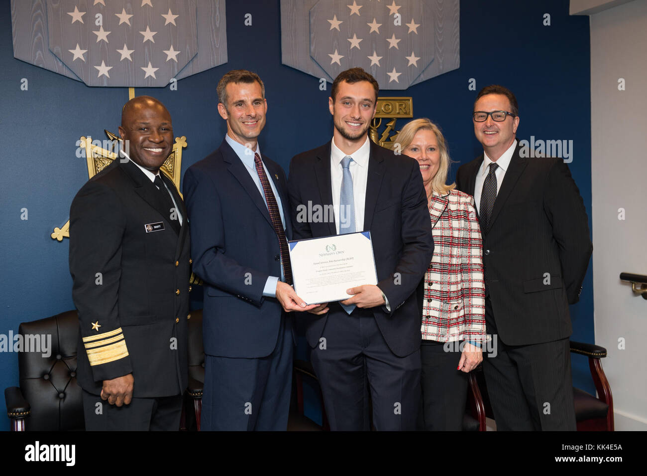 Sam Pressler, Founder and Executive Director of the Armed Services Arts Partnership (ASAP), accepts an award during the 2017 NewmanÕs Own Awards at the Hall of Heroes in the Pentagon, Oct. 11, 2017. Through ASAP, veterans reintegrate into civilian life through a collaborative, community-driven, and deeply focused program model. The annual competition seeks to reward ingenuity for programs that benefit service men, women, and their families. To date, the competition has recognized 174 programs with awards totally $1, 725,000. (DoD Photo by U.S. Army Sgt. James K. McCann) Stock Photo